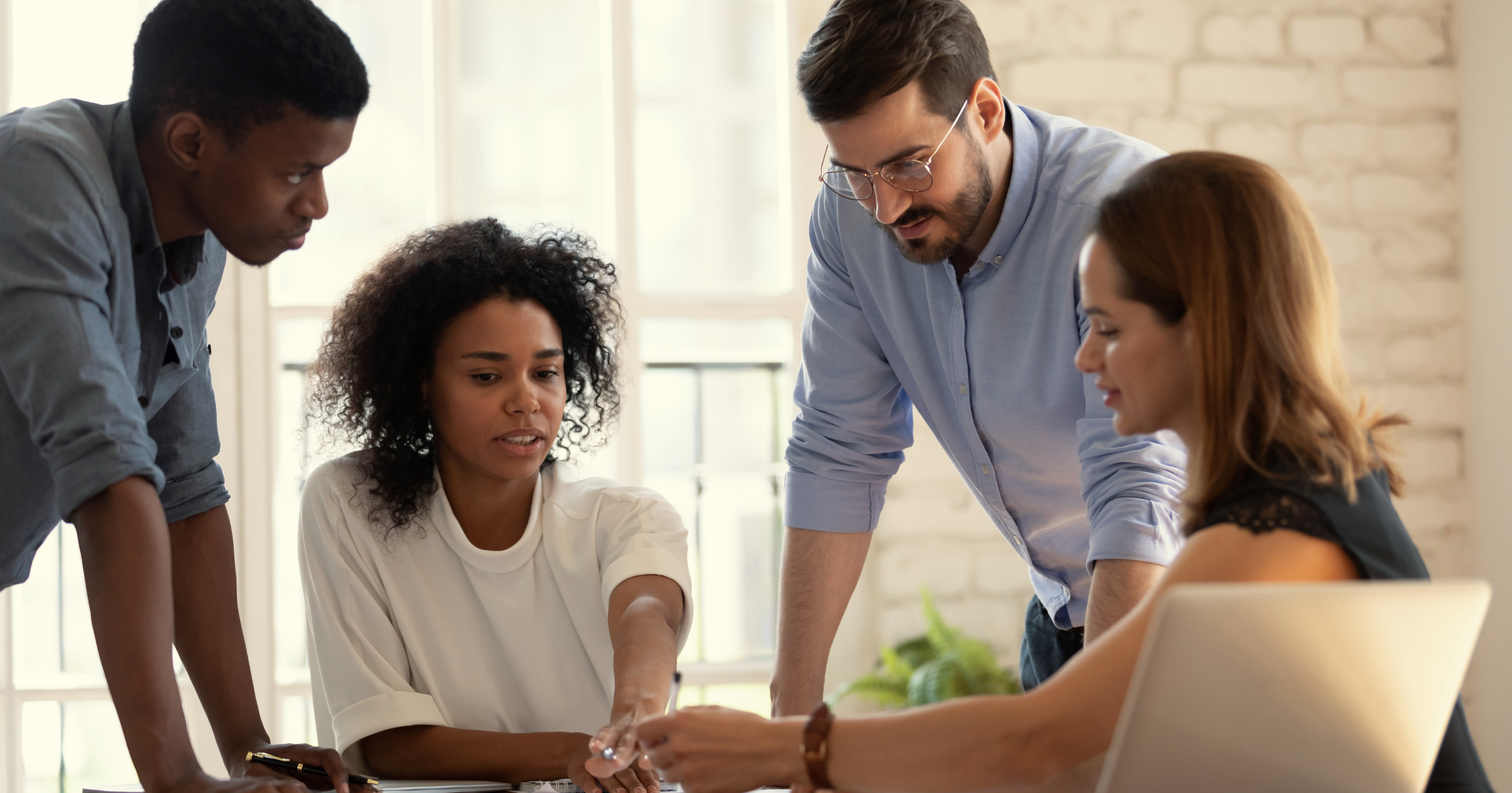 A team of talent acquisition professionals in a meeting